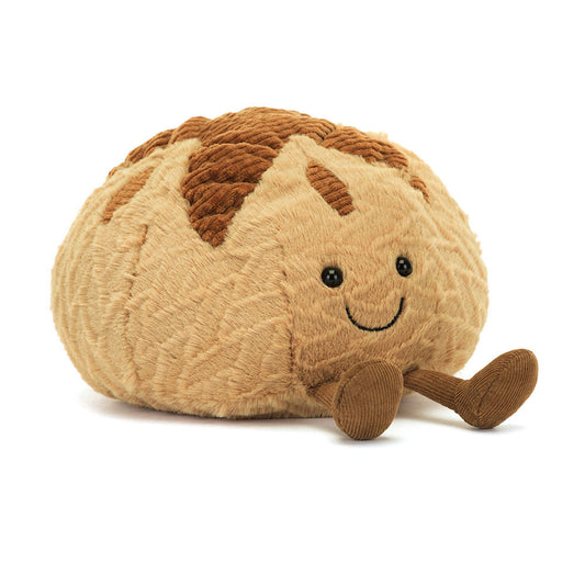 Crafted as a soft, squishy loaf with charming details, this plush companion brings warmth and a touch of whimsy to any cuddle session.